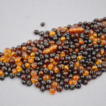 150 Unit Amber Loose Beads, Plus 2 Screw Plastic..